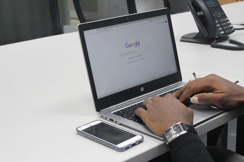 man uses google to find new job opportunities