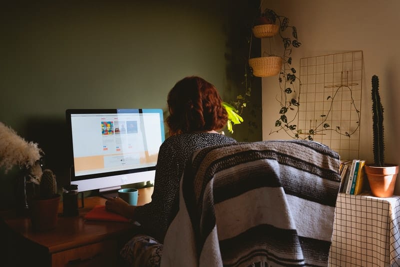 woman feels lonely working from home while sitting in front of the computer