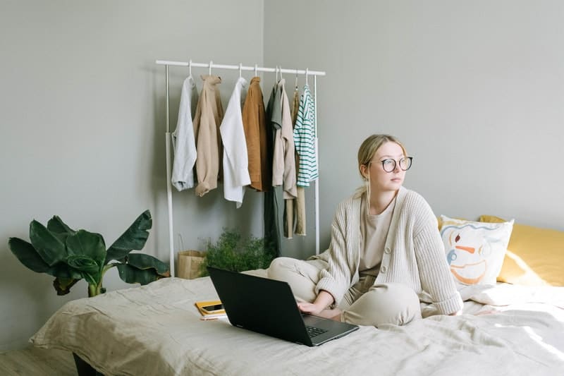 woman feeling lonely working from home on her laptop