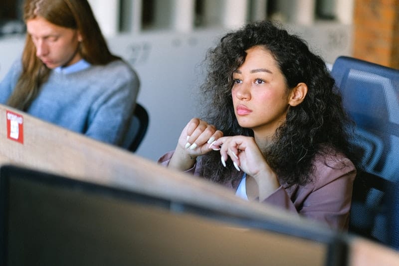 young business woman thinking while working at the office