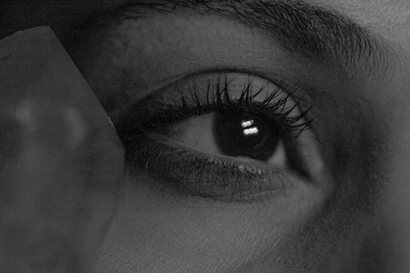 black and white photo of a closeup of a woman's eye