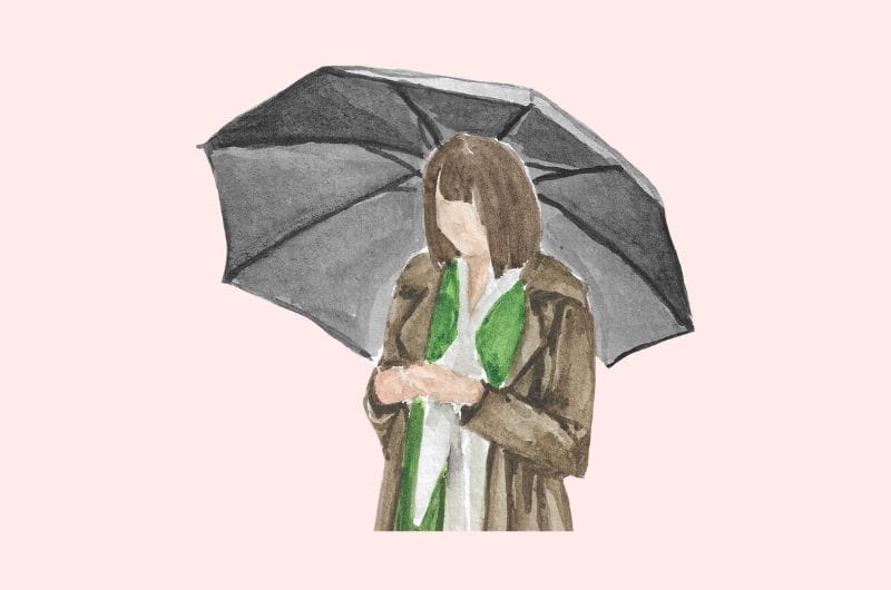 an illustration of a woman standing alone with an umbrella